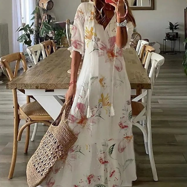 <html><body><p>Lilly - Elegante maxi dress con stampa floreale e maniche a metà con scollatura a V</p></body></html>